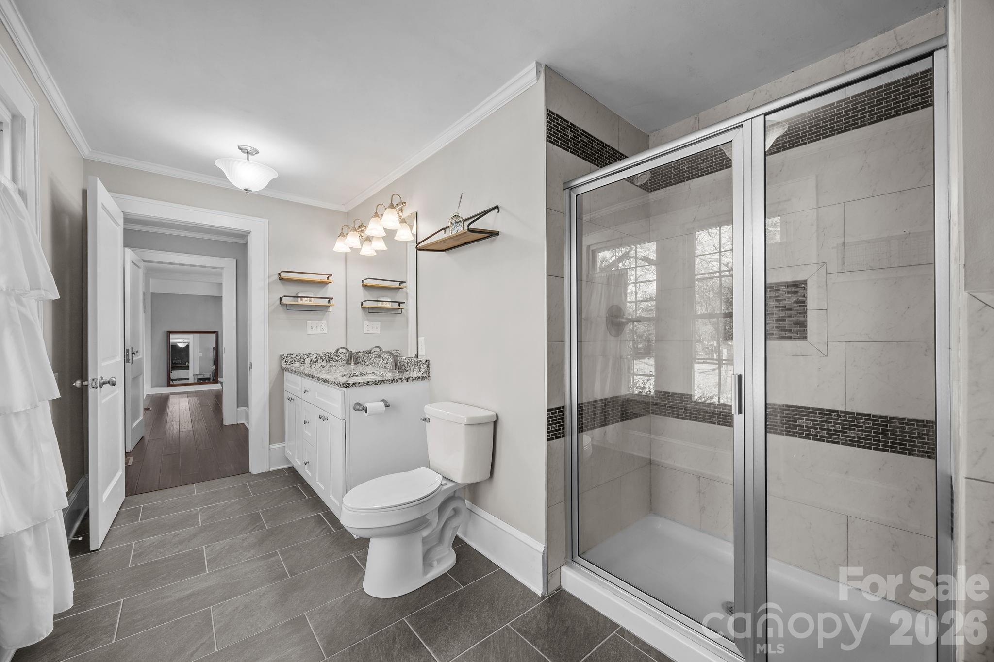 455 Eudy Road China Grove, NC 28023 - Photo 21 of 32 a bathroom with a toilet a shower and a sink