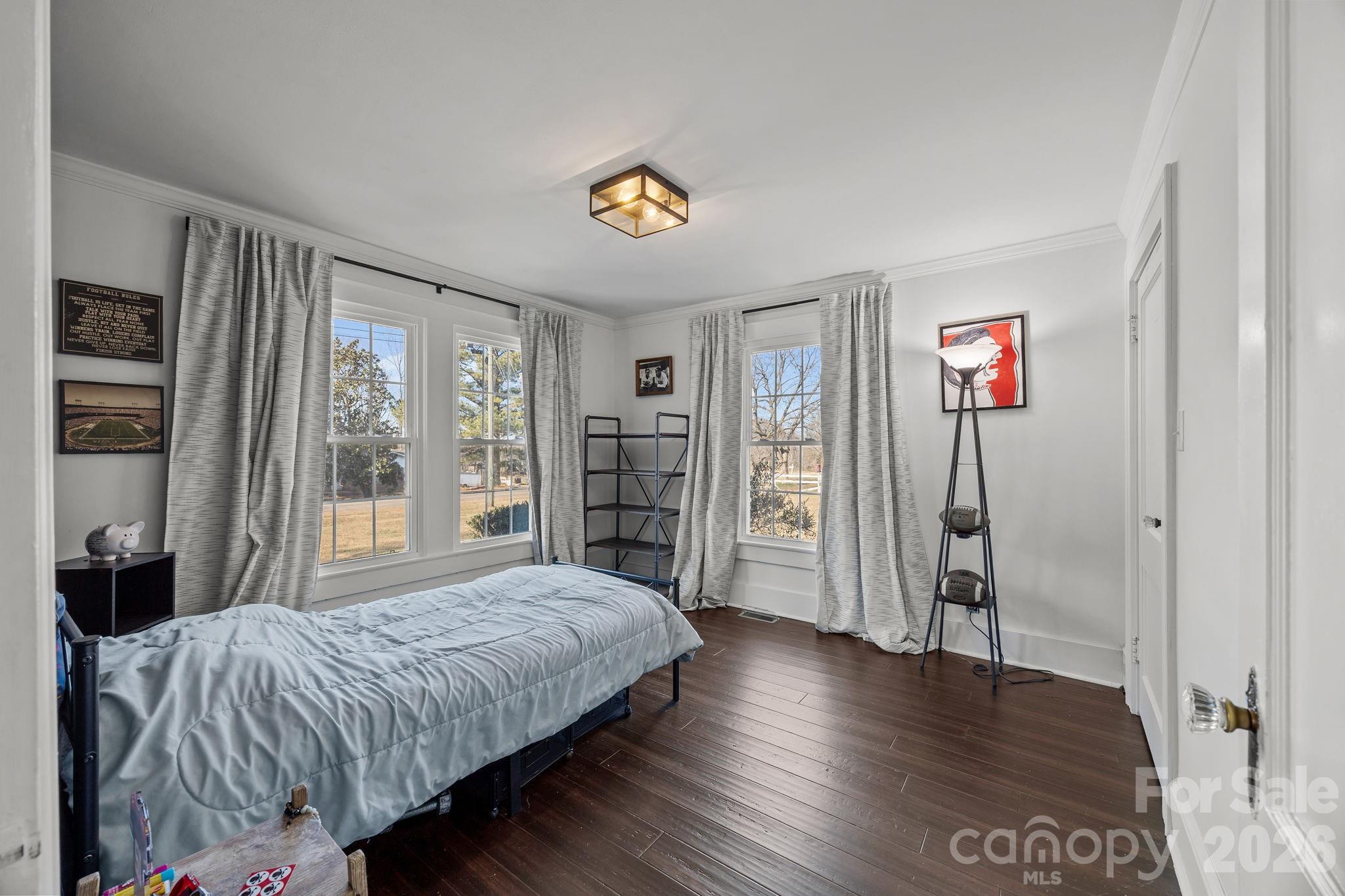 455 Eudy Road China Grove, NC 28023 - Photo 24 of 32 a bedroom with a bed and a large window with wooden floor