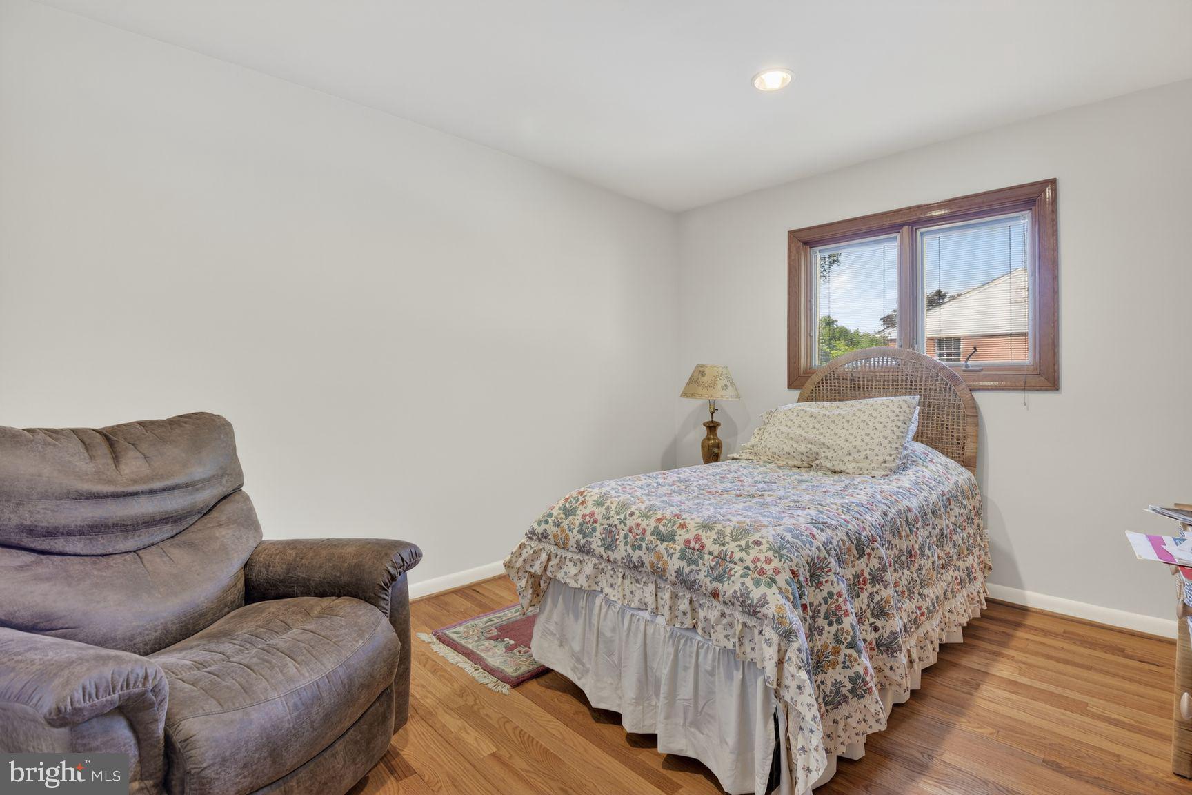 5800 Plainview Road Bethesda, MD 20817 - Photo 15 of 30 a bedroom with a bed and couch