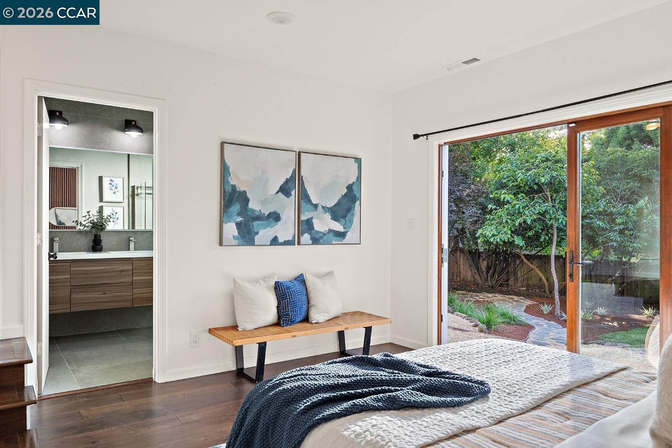 85 Ardmore Road Kensington, CA 94707 - Photo 20 of 45 a bedroom with a bed and wooden floor