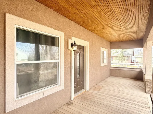 a bathroom with a sink and a large window