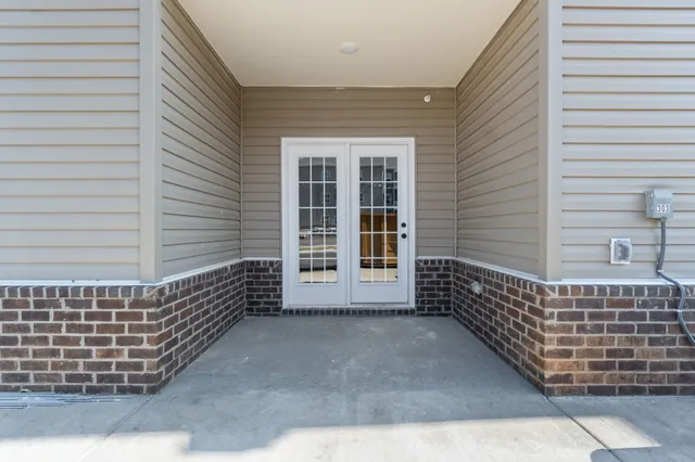 a view of wooden balcony with a swing