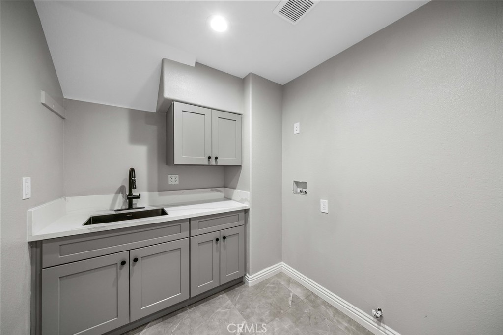 53 Middleton Irvine, CA 92620 - Photo 18 of 41 a kitchen with a sink and cabinets