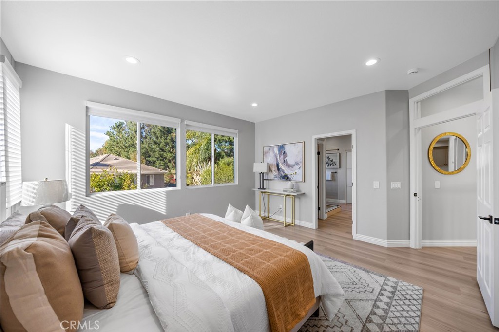 53 Middleton Irvine, CA 92620 - Photo 22 of 41 a spacious bedroom with a bed and a large window