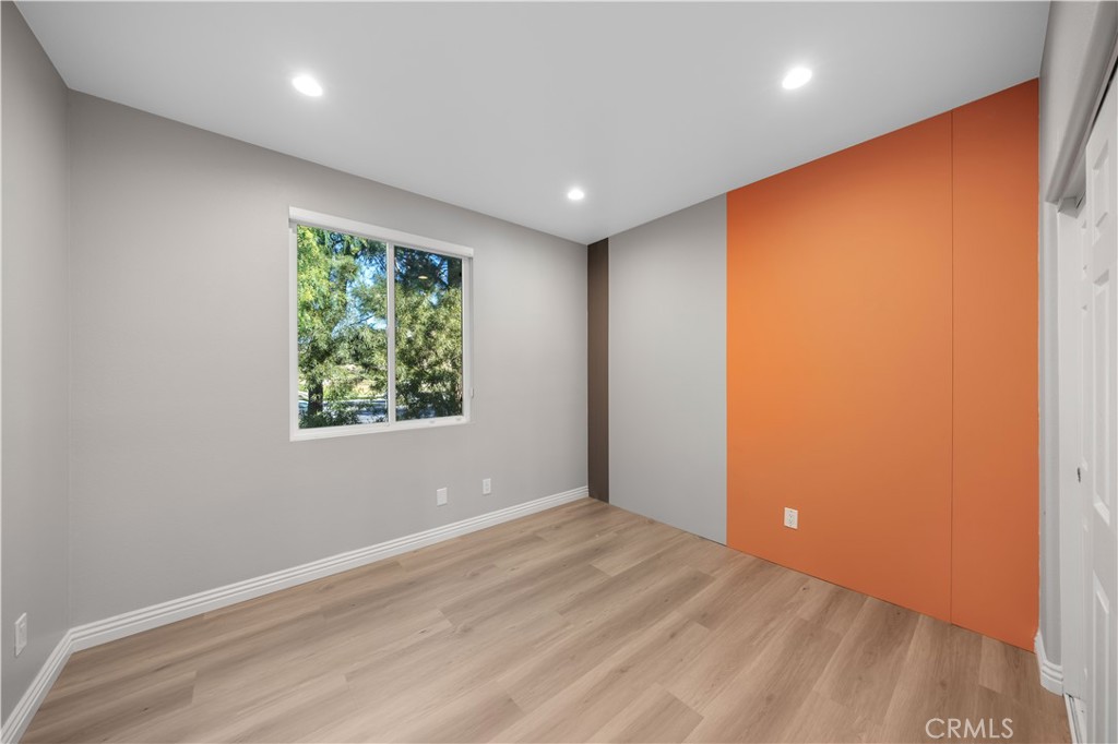 53 Middleton Irvine, CA 92620 - Photo 31 of 41 an empty room with wooden floor and windows