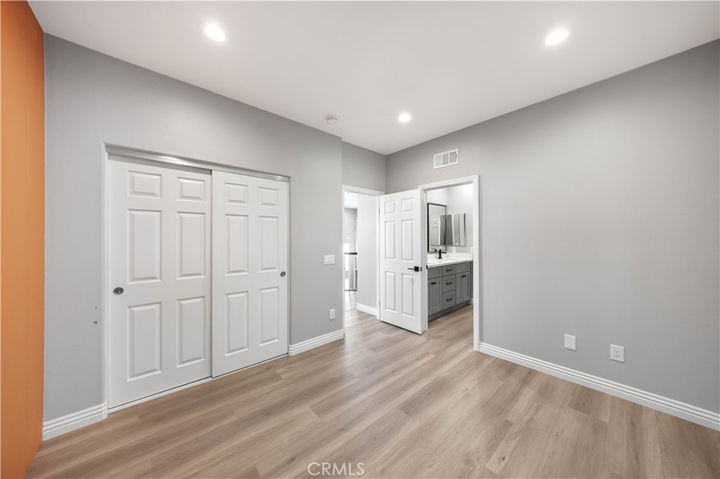 53 Middleton Irvine, CA 92620 - Photo 32 of 41 a view of a kitchen with a refrigerator and wooden floor