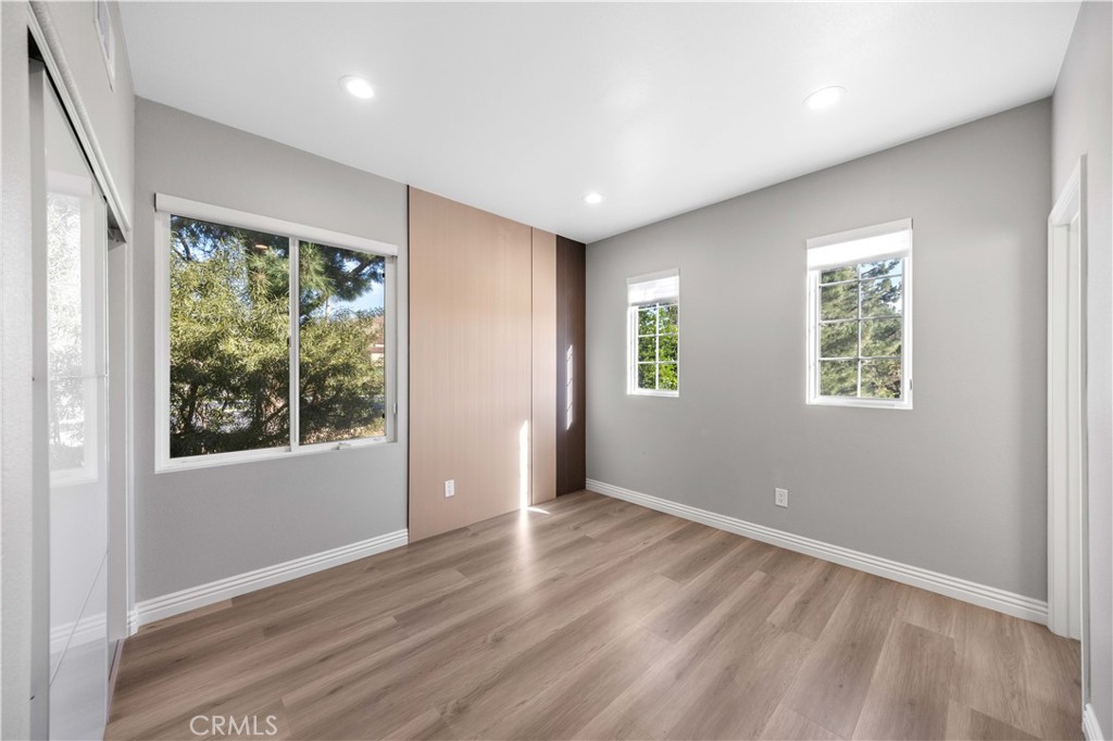 53 Middleton Irvine, CA 92620 - Photo 34 of 41 an empty room with wooden floor and windows
