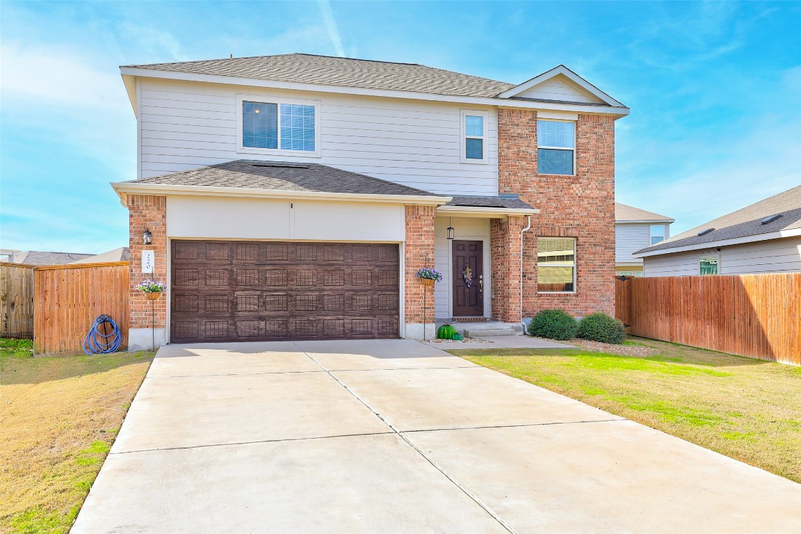 220 Xanadu Drive Jarrell, TX 76537 - Photo 1 of 1 a front view of a house with a yard and garage