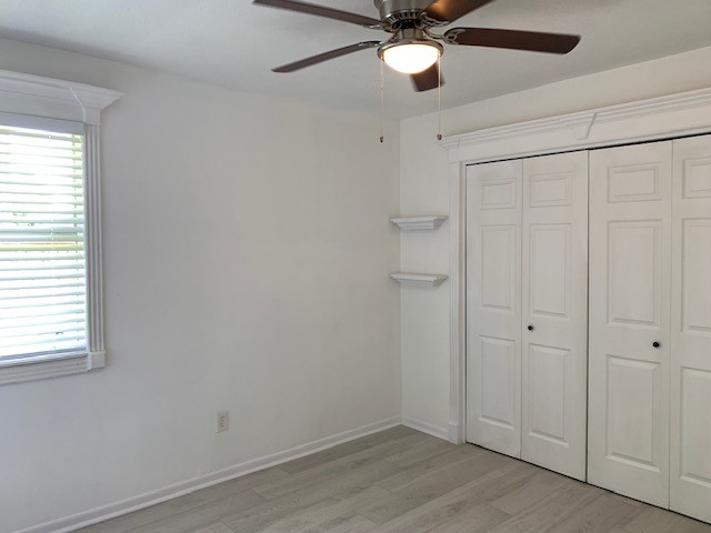 6650 Grove Field Lane Houston, TX 77084 - Photo 15 of 18 wooden floor in an empty room with a window