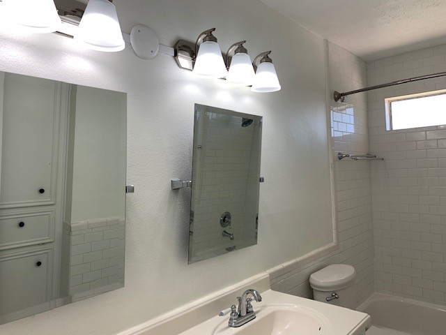 6650 Grove Field Lane Houston, TX 77084 - Photo 16 of 18 a bathroom with a sink a toilet and shower