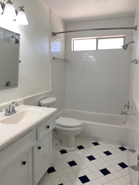 6650 Grove Field Lane Houston, TX 77084 - Photo 17 of 18 a bathroom with a sink a toilet and shower