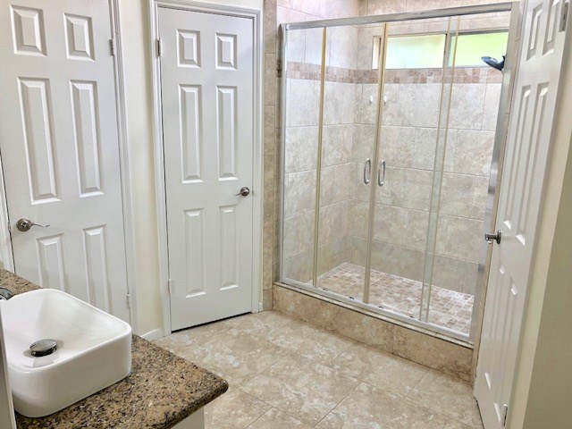 6650 Grove Field Lane Houston, TX 77084 - Photo 9 of 18 a bathroom with a tub and shower