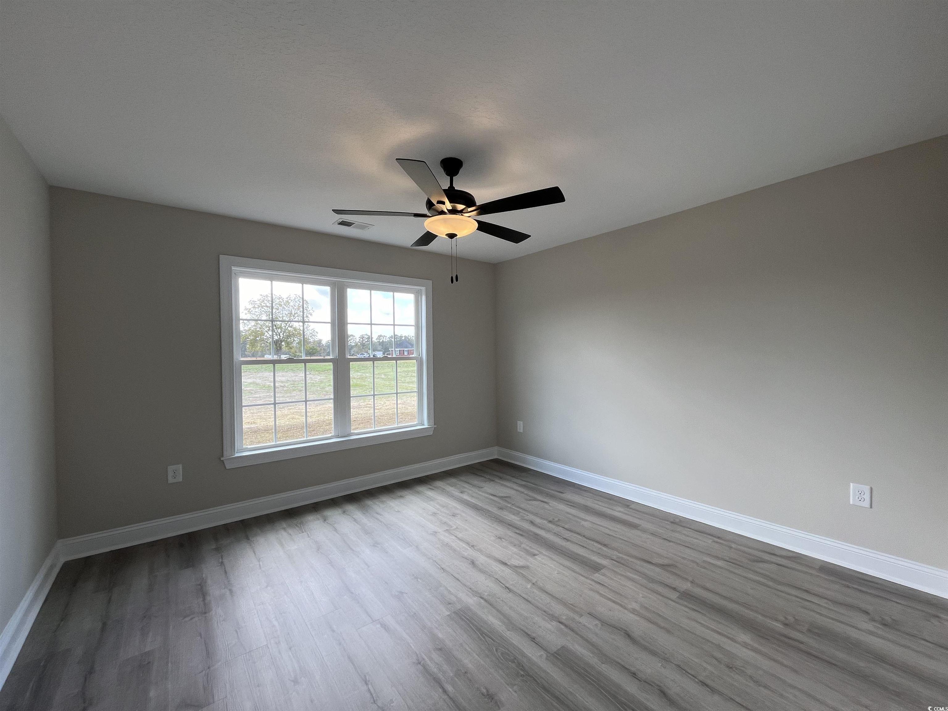 8229 Kerl Road Aynor, SC 29511 - Photo 13 of 19 Unfurnished room featuring ceiling fan and light w