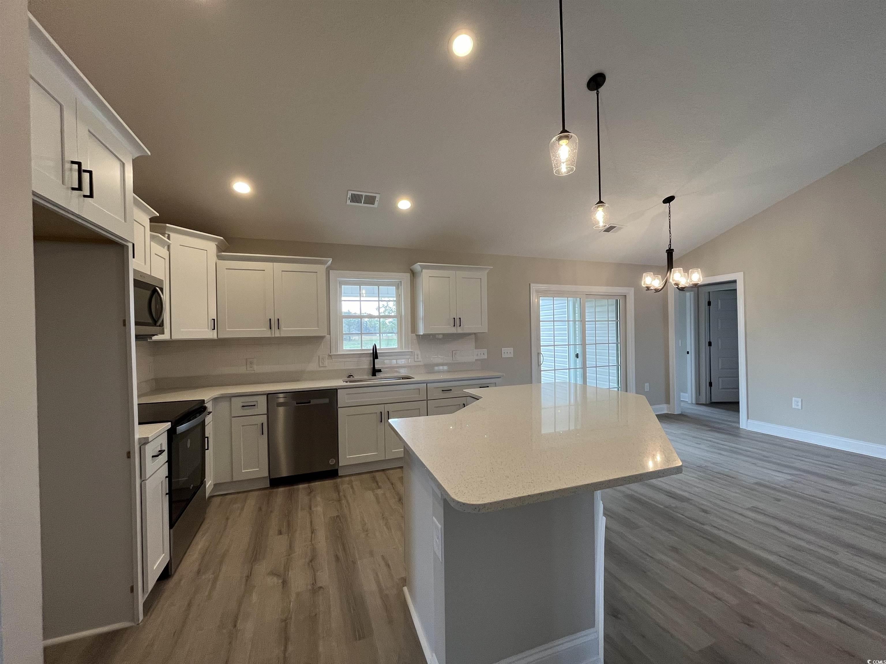 8229 Kerl Road Aynor, SC 29511 - Photo 4 of 19 Kitchen featuring white cabinetry, sink, appliance