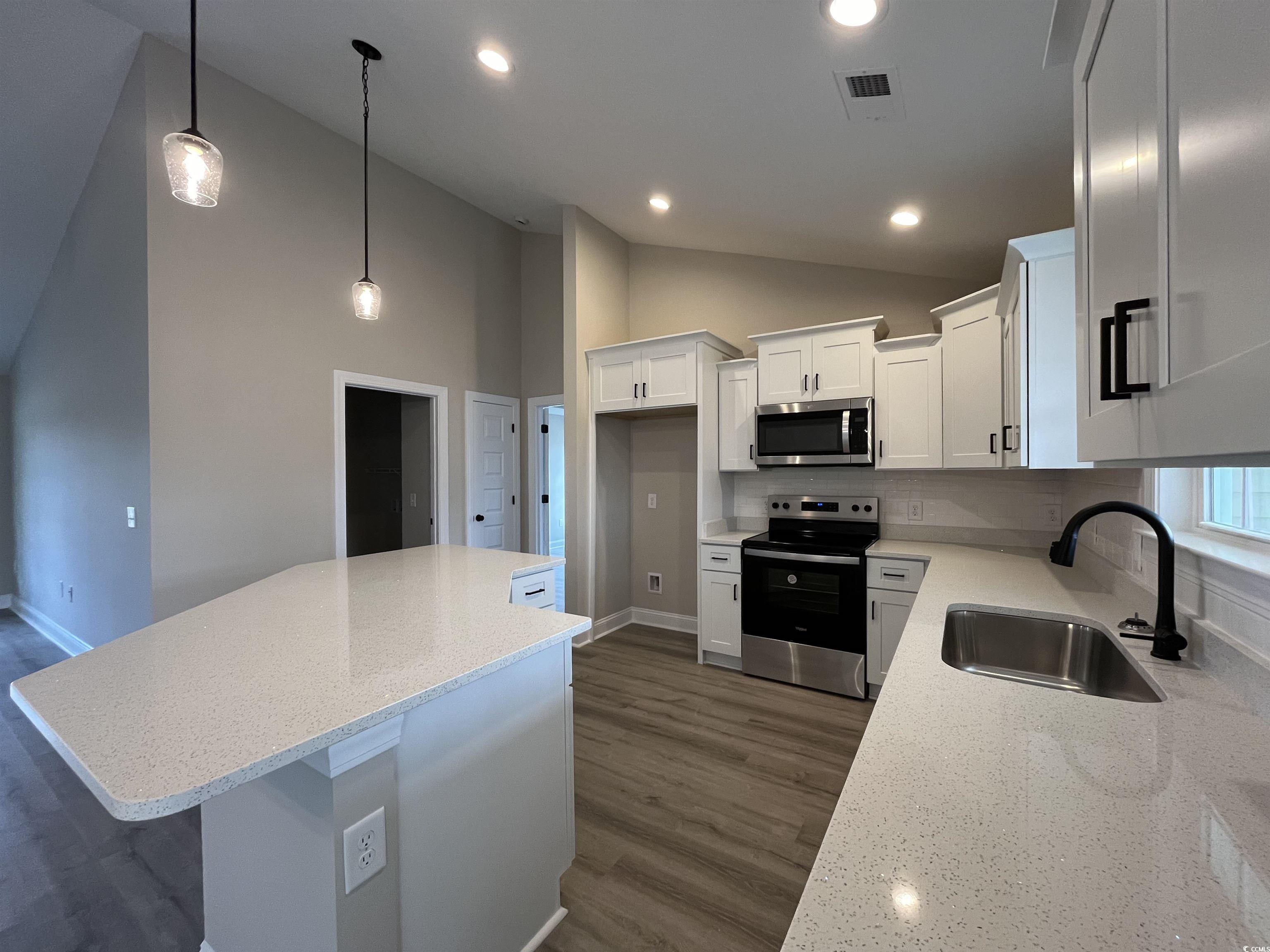 8229 Kerl Road Aynor, SC 29511 - Photo 5 of 19 Kitchen featuring white cabinetry, appliances with