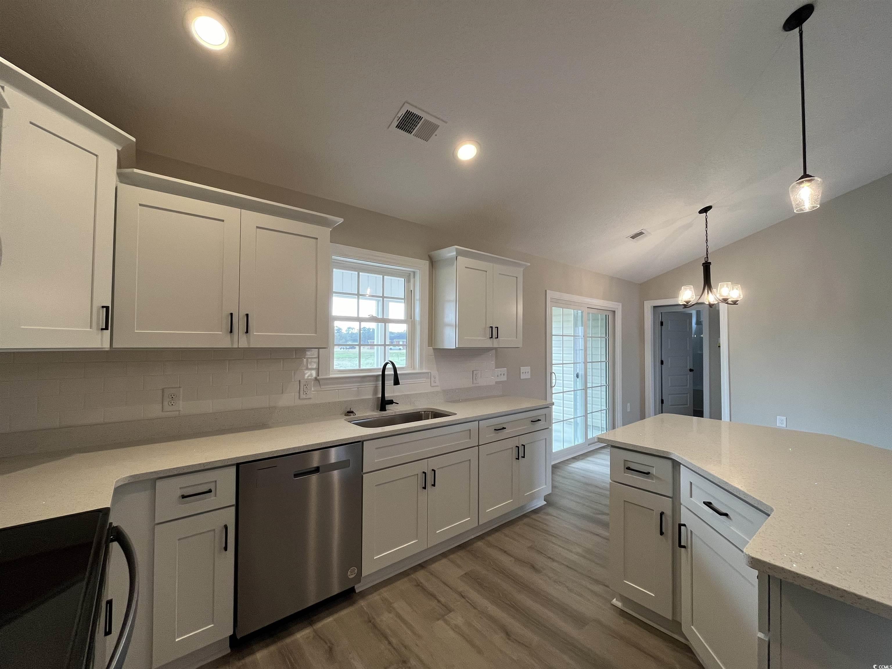 8229 Kerl Road Aynor, SC 29511 - Photo 6 of 19 Kitchen with vaulted ceiling, sink, stainless stee