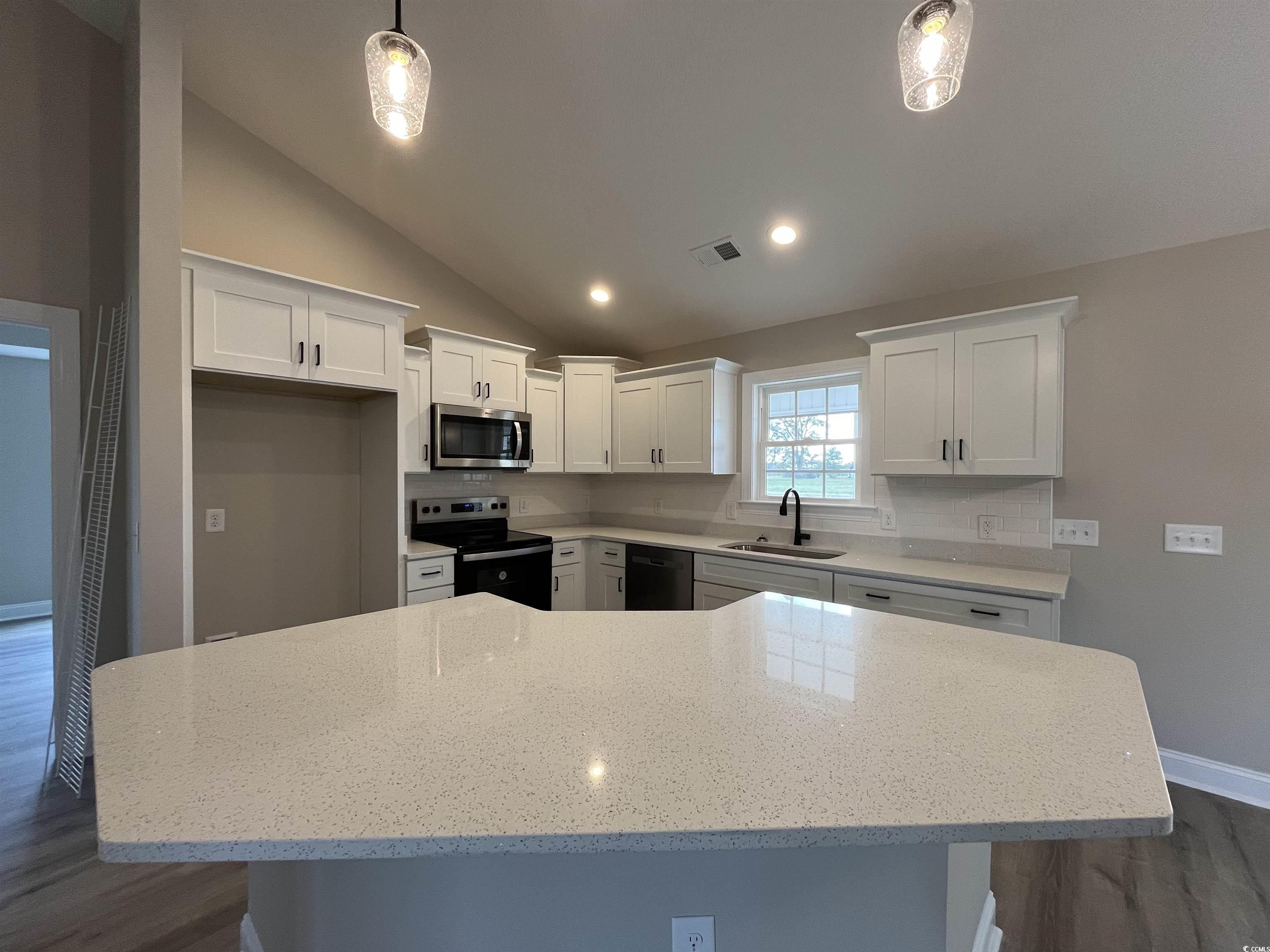 8229 Kerl Road Aynor, SC 29511 - Photo 7 of 19 Kitchen with stainless steel appliances, white cab