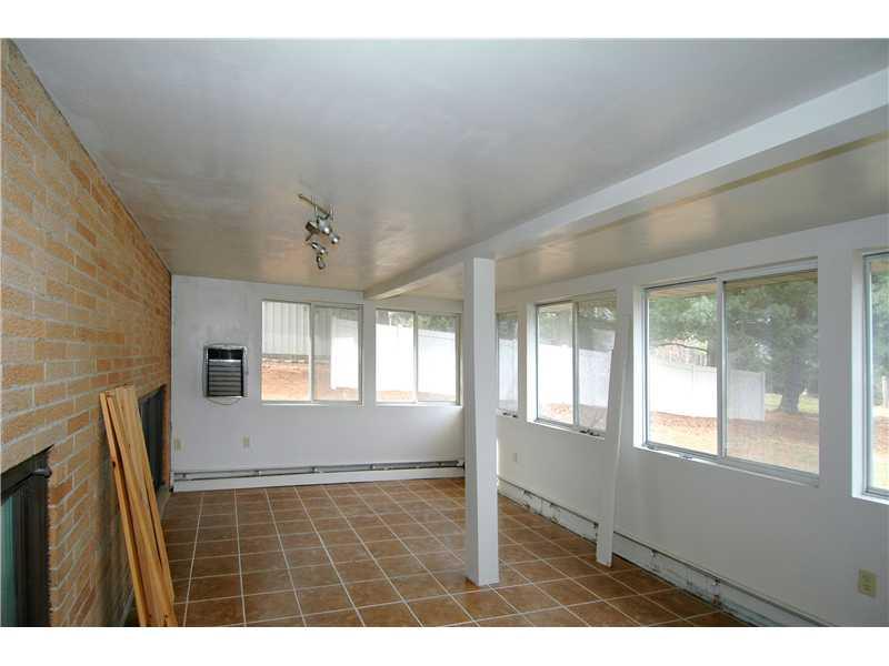 160 Pine Road Pittsburgh, PA 15237 - Photo 15 of 16 Sunroom. This home has so many great surprised-here is a sunroom/three season room with great tile floor and a view of the back yard.