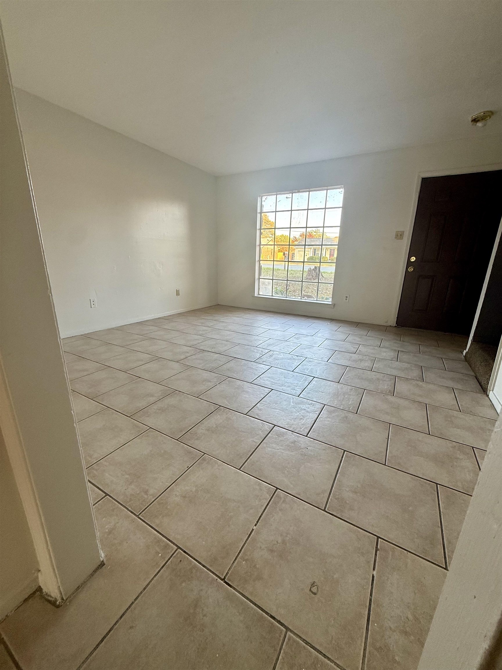 3091 Range Line Road Memphis, TN 38127 - Photo 6 of 13 Empty room with light tile patterned floors