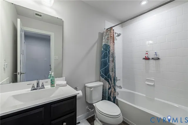 a view of a room with furniture and window