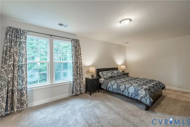 a view of a deck with two chair and wooden floor