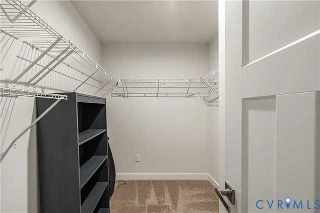 an aerial view of a house with a yard and a garden