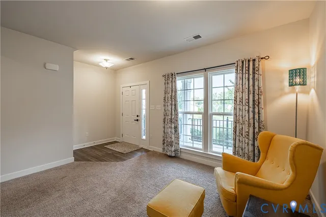 a view of a livingroom with furniture and a couch