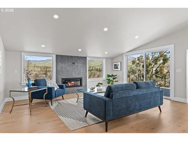 a living room with furniture and a large window