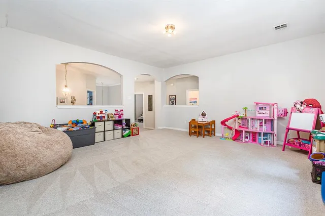 a view of a livingroom with baby toys
