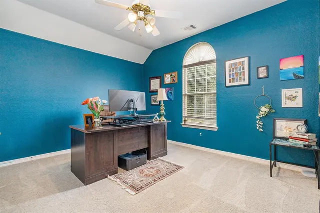 a workspace with furniture window and wooden floor