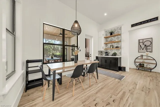 a view of a dining room with furniture and wooden floor