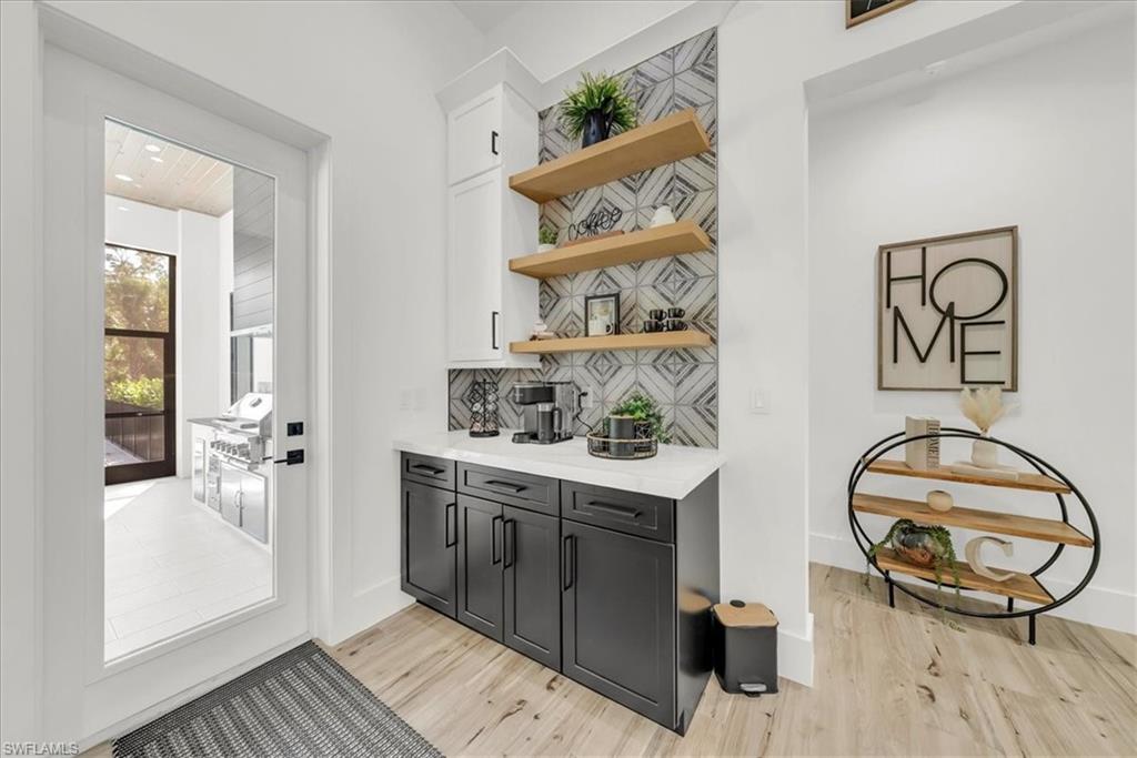 4186 3rd Avenue Northwest Naples, FL 34119 - Photo 12 of 50 a view of a hallway with washer and dryer