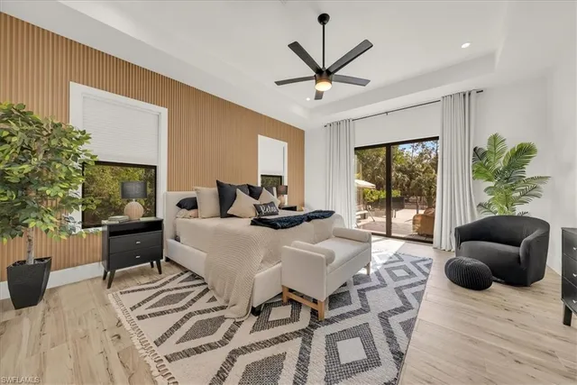 a bedroom with a couch and a potted plant