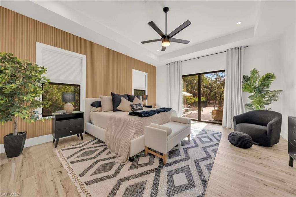 4186 3rd Avenue Northwest Naples, FL 34119 - Photo 18 of 50 a living room with furniture and a large window