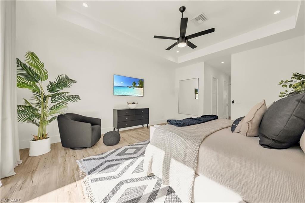 4186 3rd Avenue Northwest Naples, FL 34119 - Photo 19 of 50 a bedroom with a couch and a potted plant