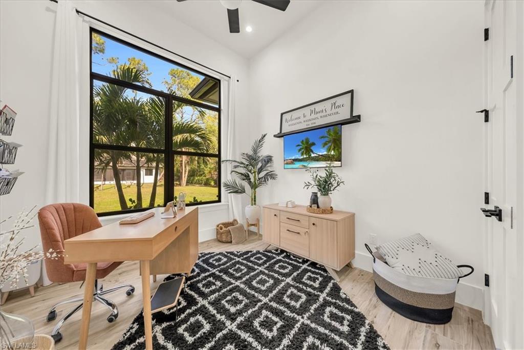 4186 3rd Avenue Northwest Naples, FL 34119 - Photo 22 of 50 a living room with furniture and a large window