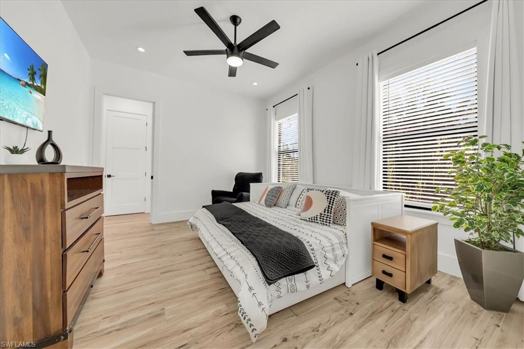 4186 3rd Avenue Northwest Naples, FL 34119 - Photo 25 of 50 a bedroom with a bed and a potted plant