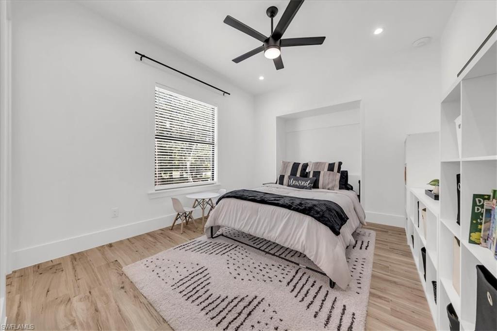 4186 3rd Avenue Northwest Naples, FL 34119 - Photo 27 of 50 a bedroom with a large bed and a window