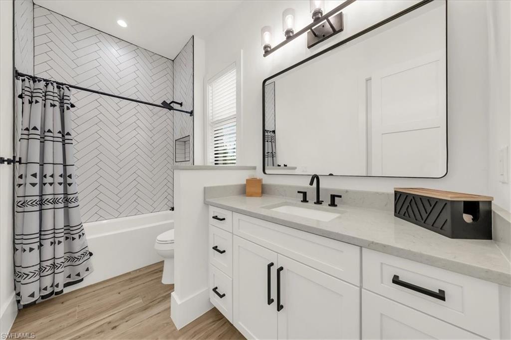 4186 3rd Avenue Northwest Naples, FL 34119 - Photo 28 of 50 a bathroom with a bathtub and a sink