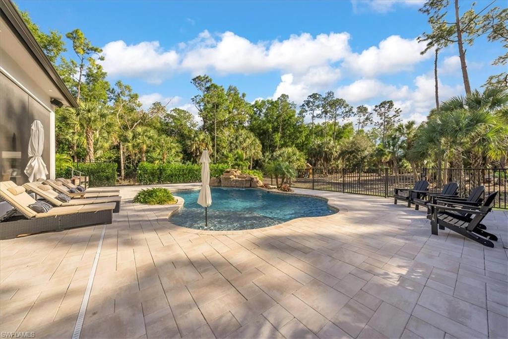 4186 3rd Avenue Northwest Naples, FL 34119 - Photo 31 of 50 a view of outdoor space with swimming pool and furniture