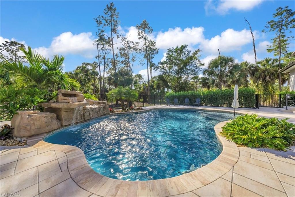 4186 3rd Avenue Northwest Naples, FL 34119 - Photo 32 of 50 a view of a fountain in the backyard of house