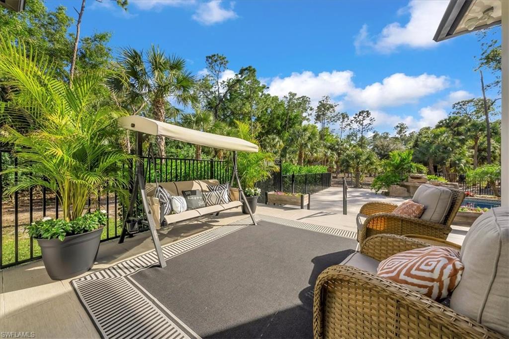 4186 3rd Avenue Northwest Naples, FL 34119 - Photo 37 of 50 a view of a patio with couches and potted plants