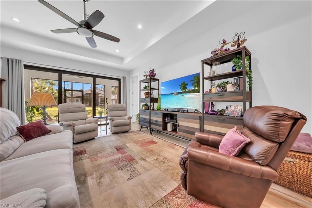 4186 3rd Avenue Northwest Naples, FL 34119 - Photo 41 of 50 a living room with furniture and a large window