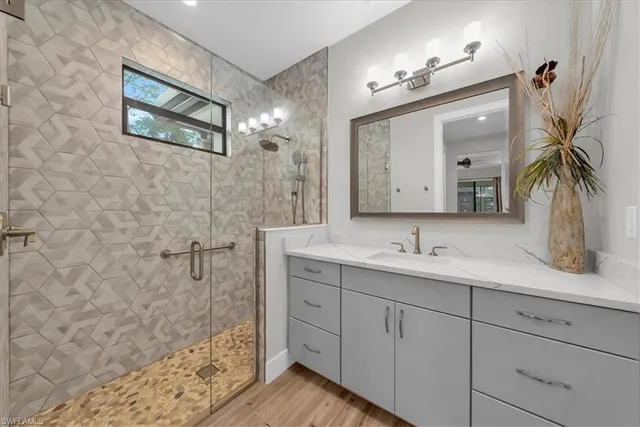 a bedroom with a bed and a mirror