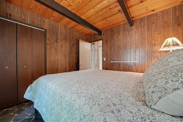 a kitchen with stainless steel appliances granite countertop a sink and a stove next to a window