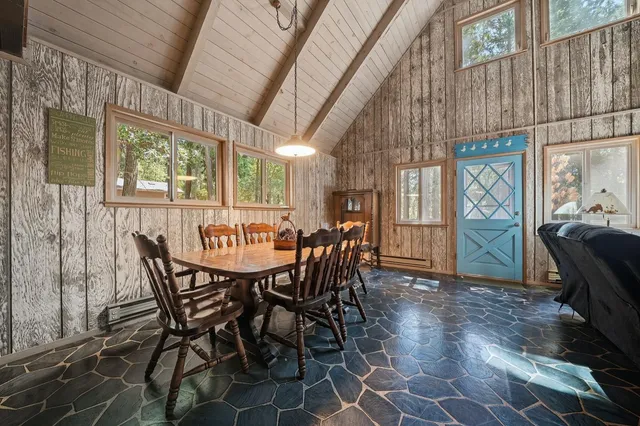 a view of a dining room with furniture window and outside view