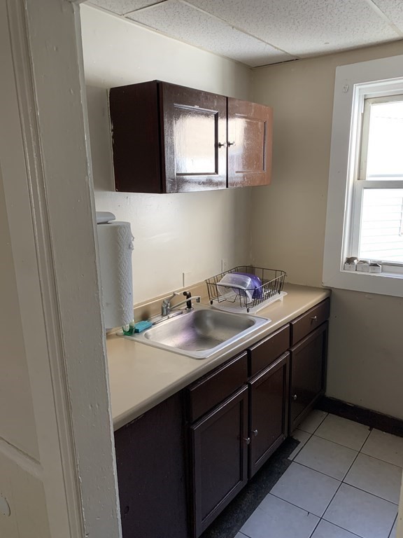 202-204 Lawrence Street Lawrence, MA 01841 - Photo 3 of 12 a bathroom with a sink and a mirror
