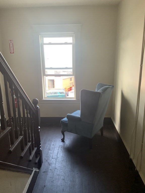 202-204 Lawrence Street Lawrence, MA 01841 - Photo 8 of 12 a view of livingroom with chair and a window