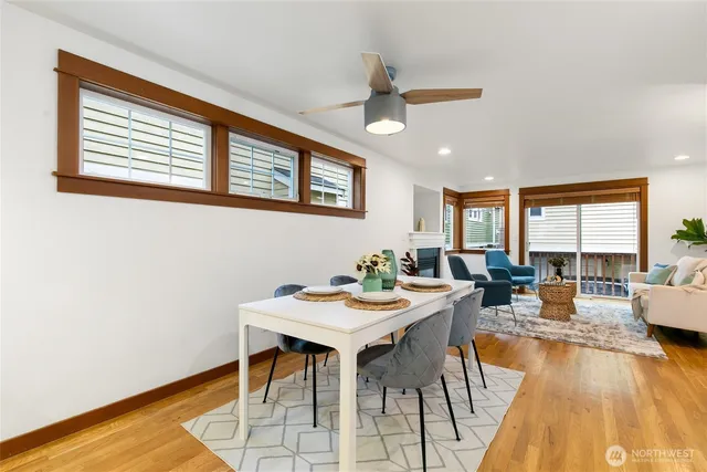 a view of a dining room with furniture window and wooden floor