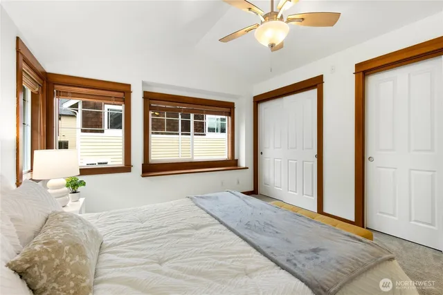 a bedroom with a bed window and wall painting